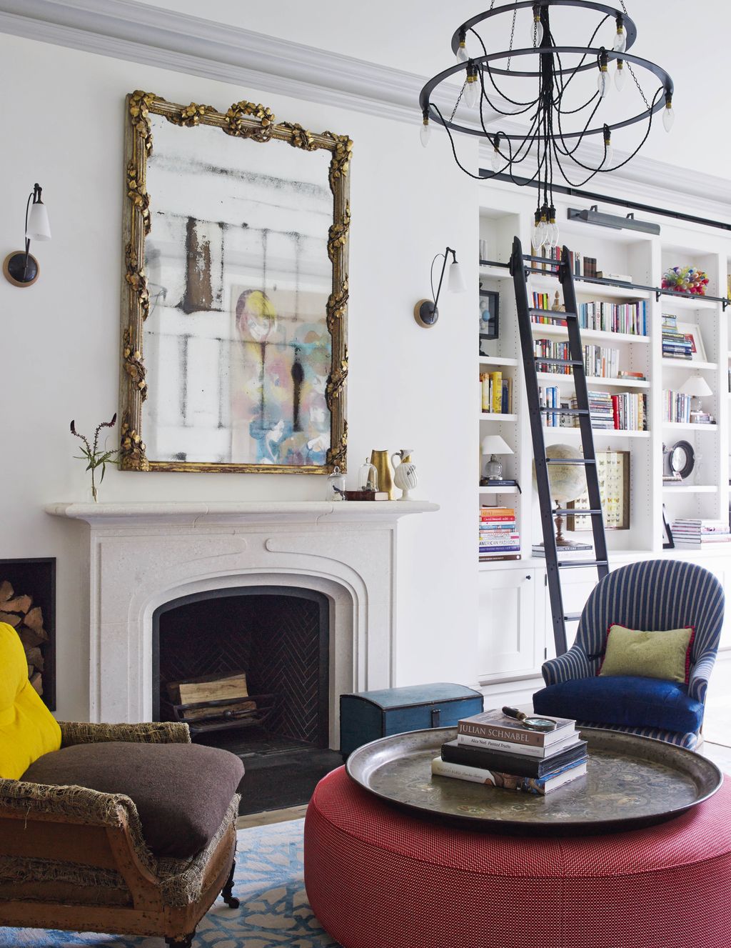 On one side of the sitting room a late nineteenthcentury mirror from Rose Uniacke hangs above a marble chimneypiece from...