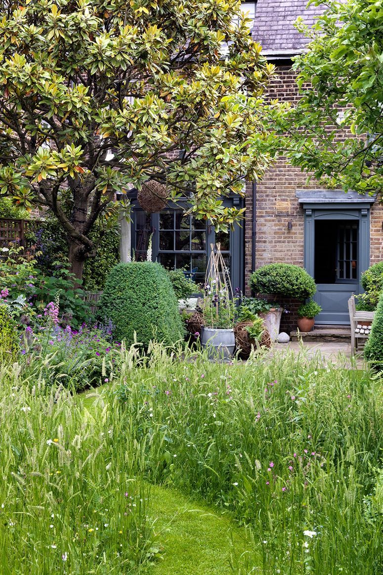 Image may contain: Outdoors, Garden, Vase, Plant, Pottery, Potted Plant, Jar, Arbour, Planter, Herbs, Yard, Nature, and Grass
