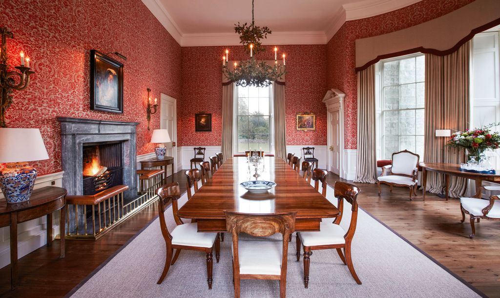 Image may contain Furniture Chair Fireplace Indoors Room Dining Room Flooring Interior Design Hardwood and Wood