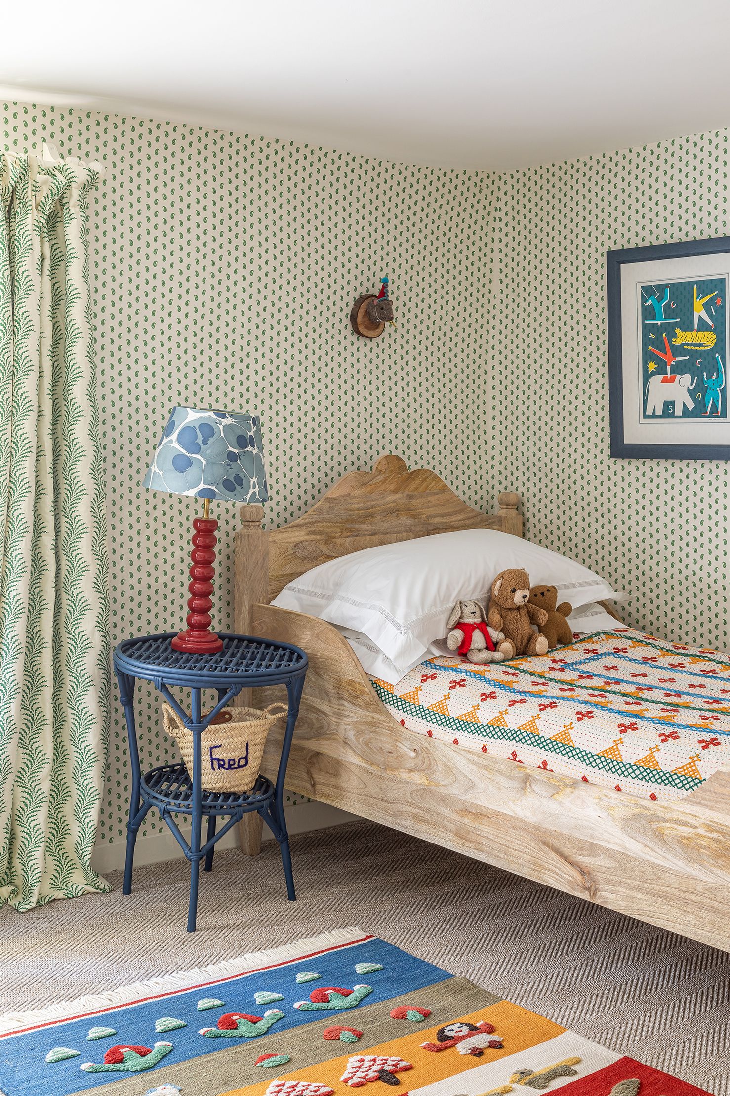 In her son's room at in her Wiltshire cottage Katharine Paravicini has used a Howe wallpaper 'Mr Men' for her son's room...