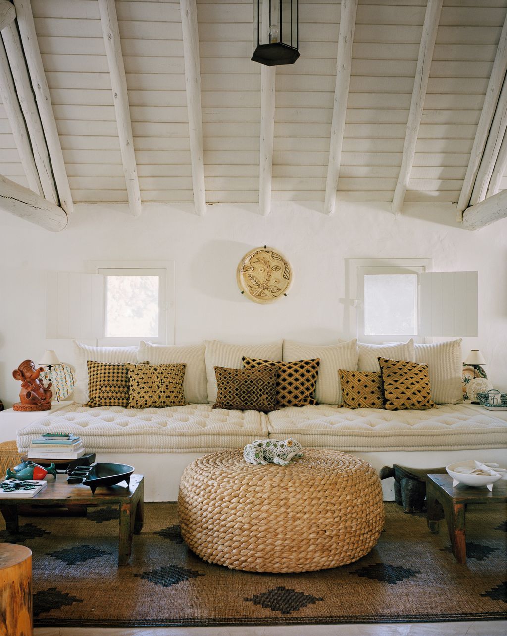 Image may contain Furniture Living Room Room Indoors Table Rug Interior Design Couch Coffee Table and Flooring