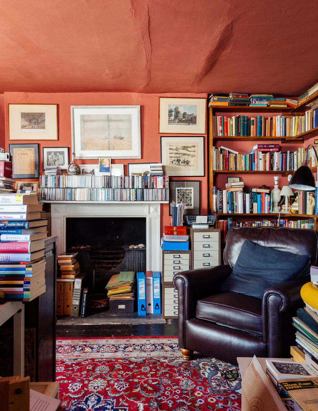 Image may contain Furniture Bookcase Shelf Indoors Living Room Room Interior Design and Rug