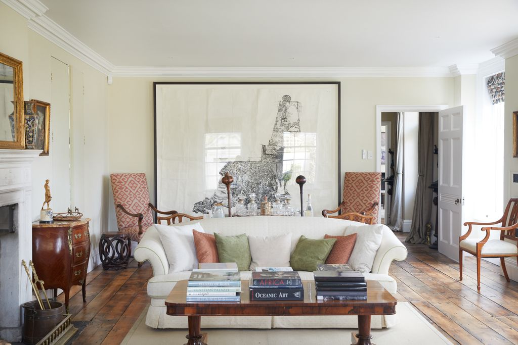Image may contain Furniture Living Room Room Indoors Table Coffee Table Interior Design Couch Flooring and Wood