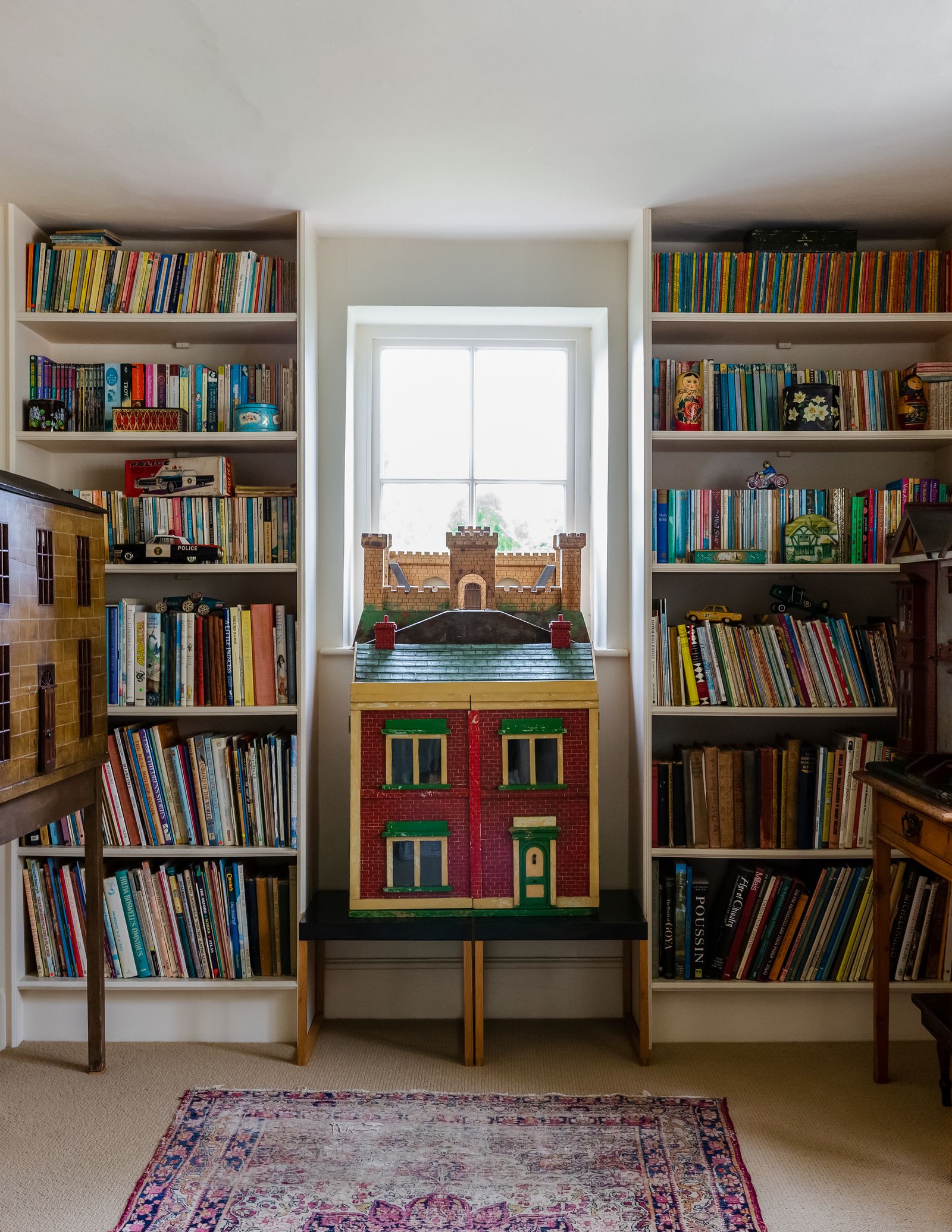 Bookshelves on the landing in Ros Byam Shaw's 16thcentury country house in Devon hold childrens books as well as three...
