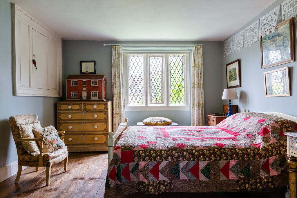 Image may contain Furniture Indoors Room Bedroom Interior Design Bed Rug and Cabinet