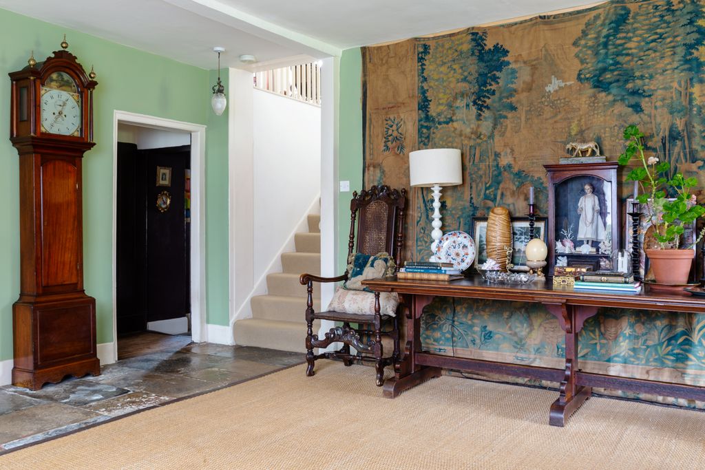 Image may contain Flooring Human Person Furniture Wood Floor Living Room Indoors Room Hardwood and Interior Design
