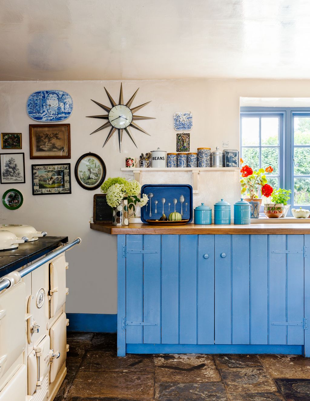 In Ros Byam Shaw's Devon house the kitchen cabinets are painted in Farrow  Ball's aptly named ‘Cook's Blue to match the...