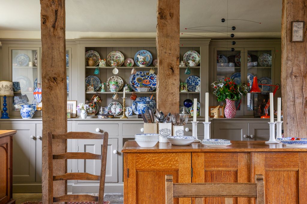 A builtin dresser that's partly glazed partly open takes up one wall of the kitchen in Ros Byam Shaw's Devon house. The...
