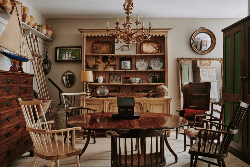 Image may contain Furniture Chair Dining Table Table Room Indoors Dining Room Living Room Wood and Lamp