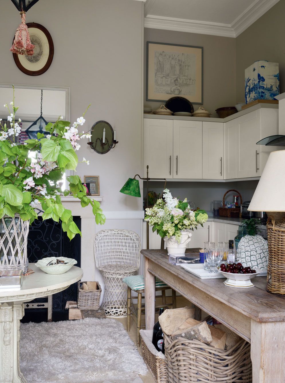 Image may contain Furniture Indoors Interior Design Plant Flower Blossom Living Room Room Table Chair and Shelf
