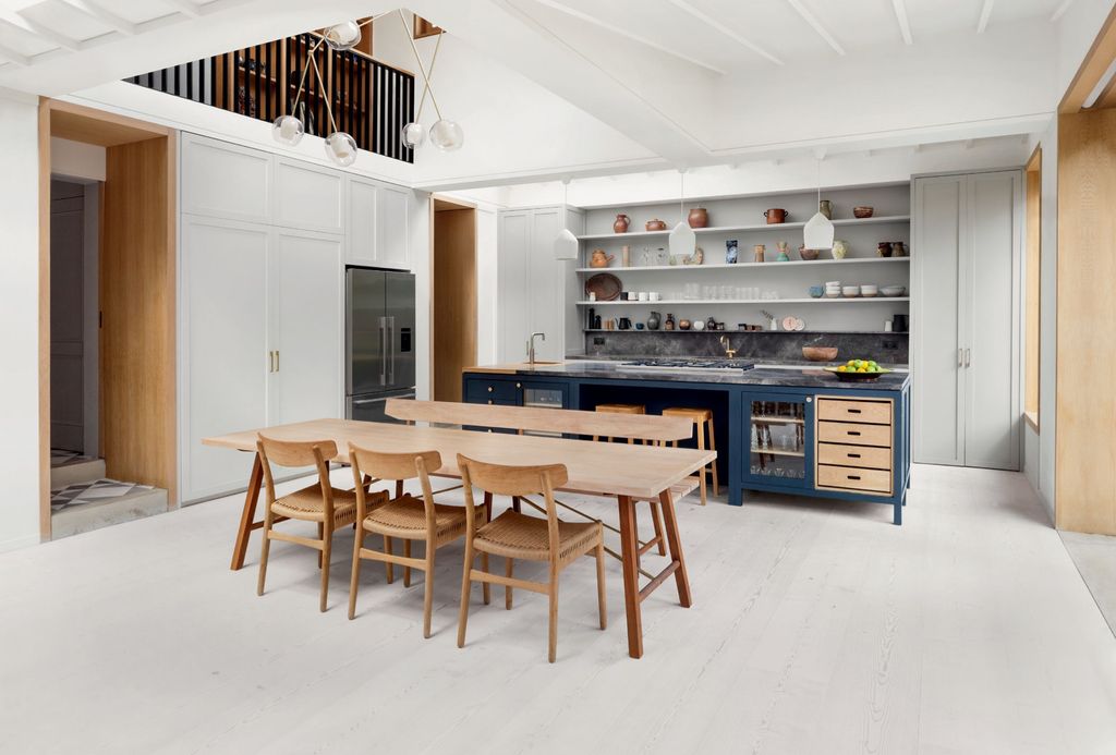 Image may contain Wood Plywood Furniture Chair Restaurant Housing Building Kitchen Island Indoors and Table