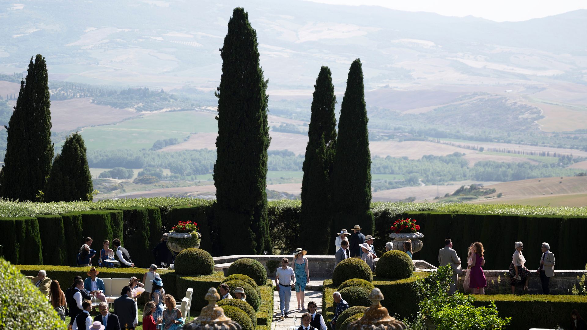 Image may contain Human Person Plant Outdoors Hedge and Fence