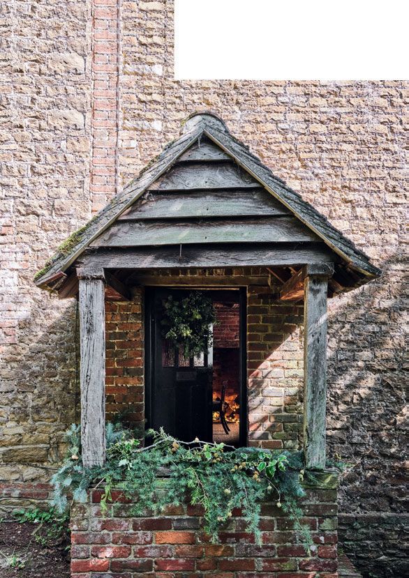 The cottage decked with seasonal greenery.