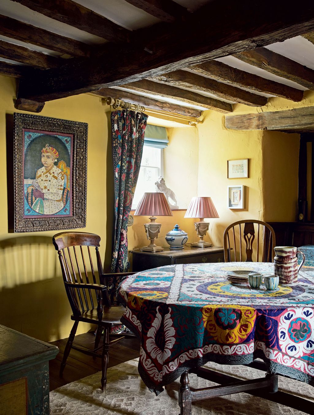 Image may contain Furniture Chair Living Room Room Indoors Home Decor Dining Table Table Couch and Bairam Khan