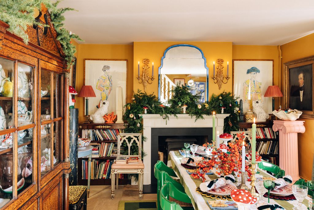 The dining room is painted in Farrow Ball's ‘India Yellow with a fireplace at one end framed by two of Luke's original...