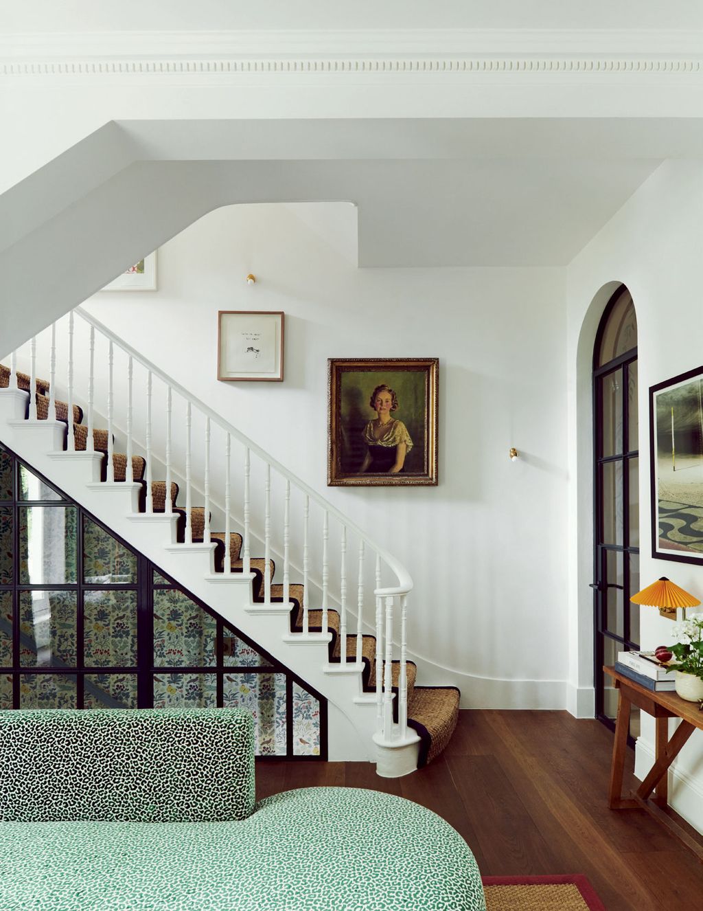 Image may contain Staircase Interior Design Indoors Flooring Human Person Living Room Room Banister and Handrail