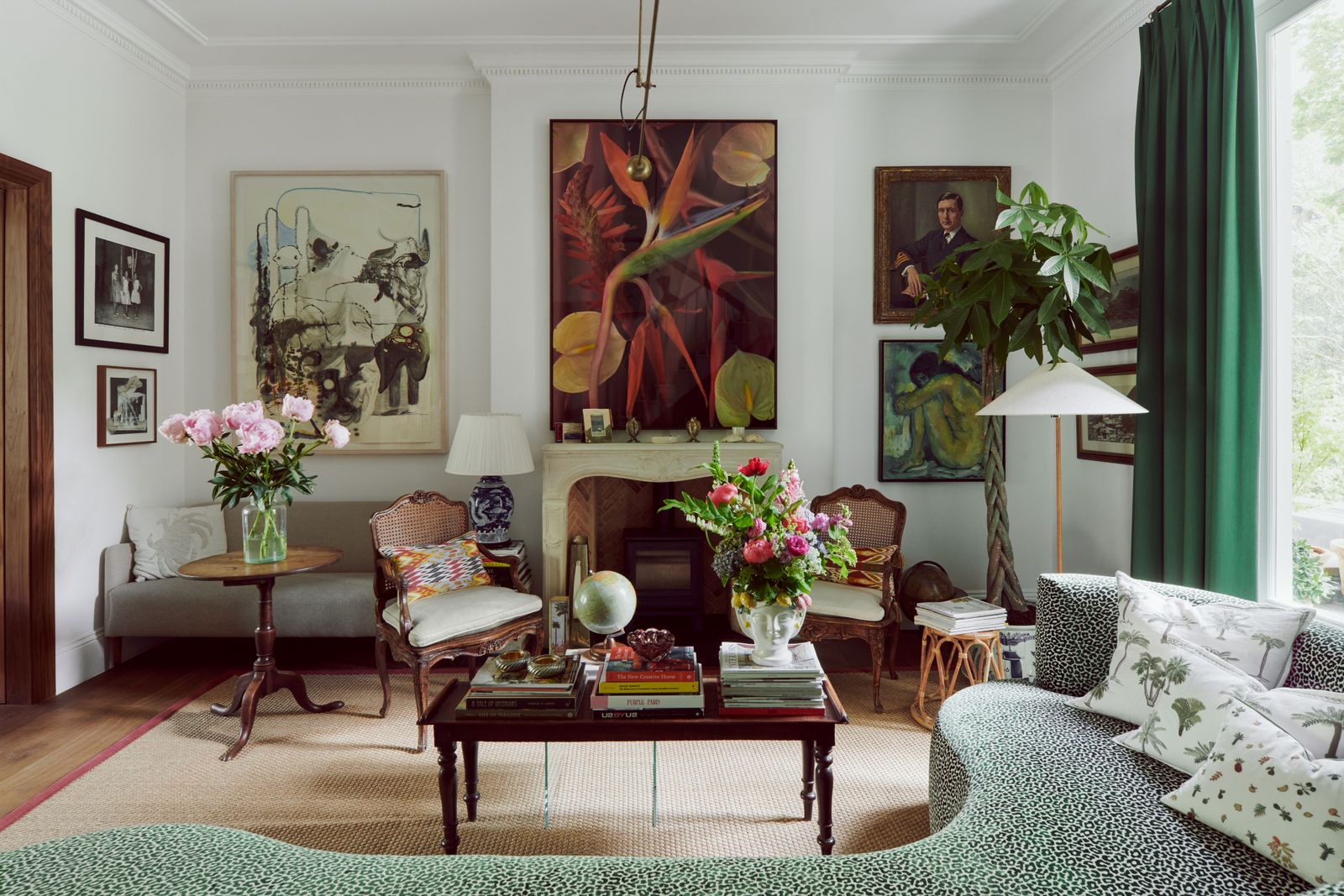 Image may contain Living Room Room Indoors Furniture Interior Design Couch Plant Rug Human Person and Flower