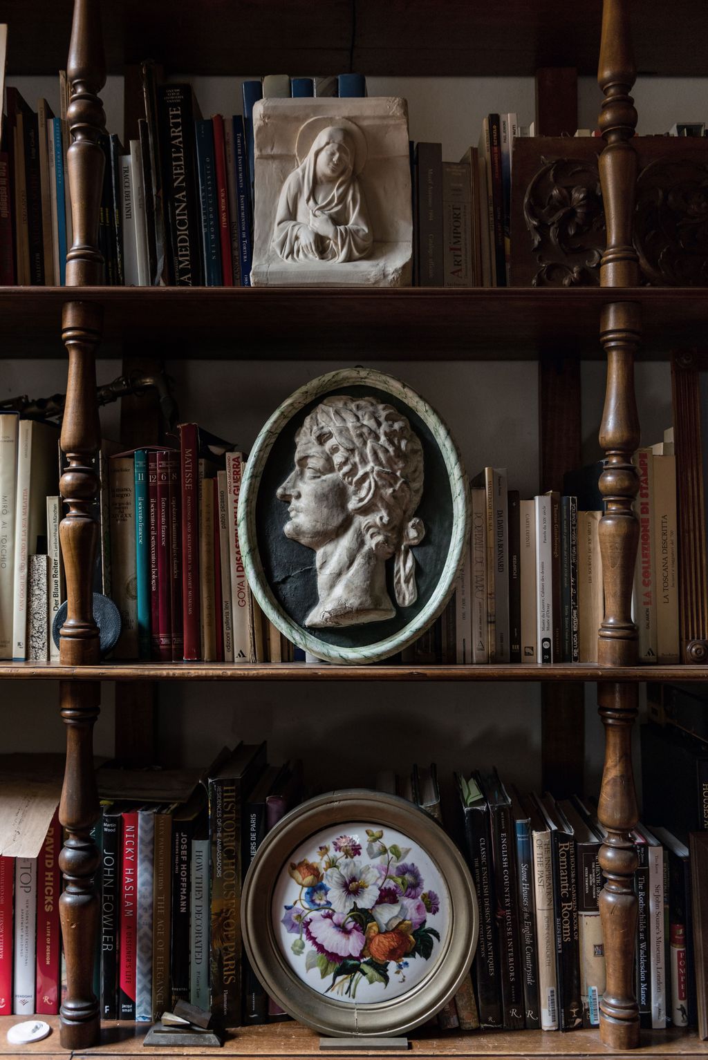 Image may contain Furniture Shelf Bookcase Book Building Clock Tower Architecture and Tower