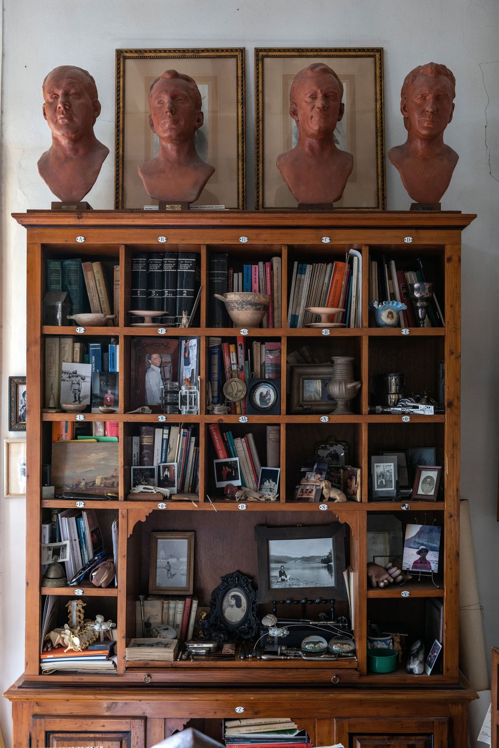 Image may contain Furniture Shelf Bookcase Human and Person
