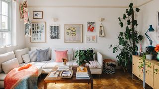 Image may contain Furniture Living Room Room Indoors Table Coffee Table Couch Interior Design Cushion and Flooring