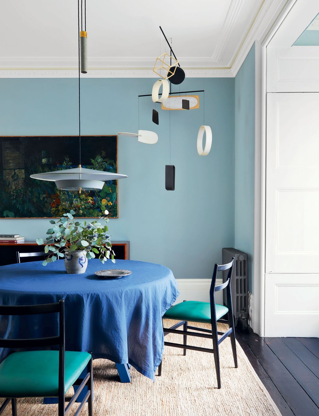 Walls in Edward Bulmer Natural Paints ‘Aerial Tint set a calm tone. The mobile was commissioned from sculptor Daniel...