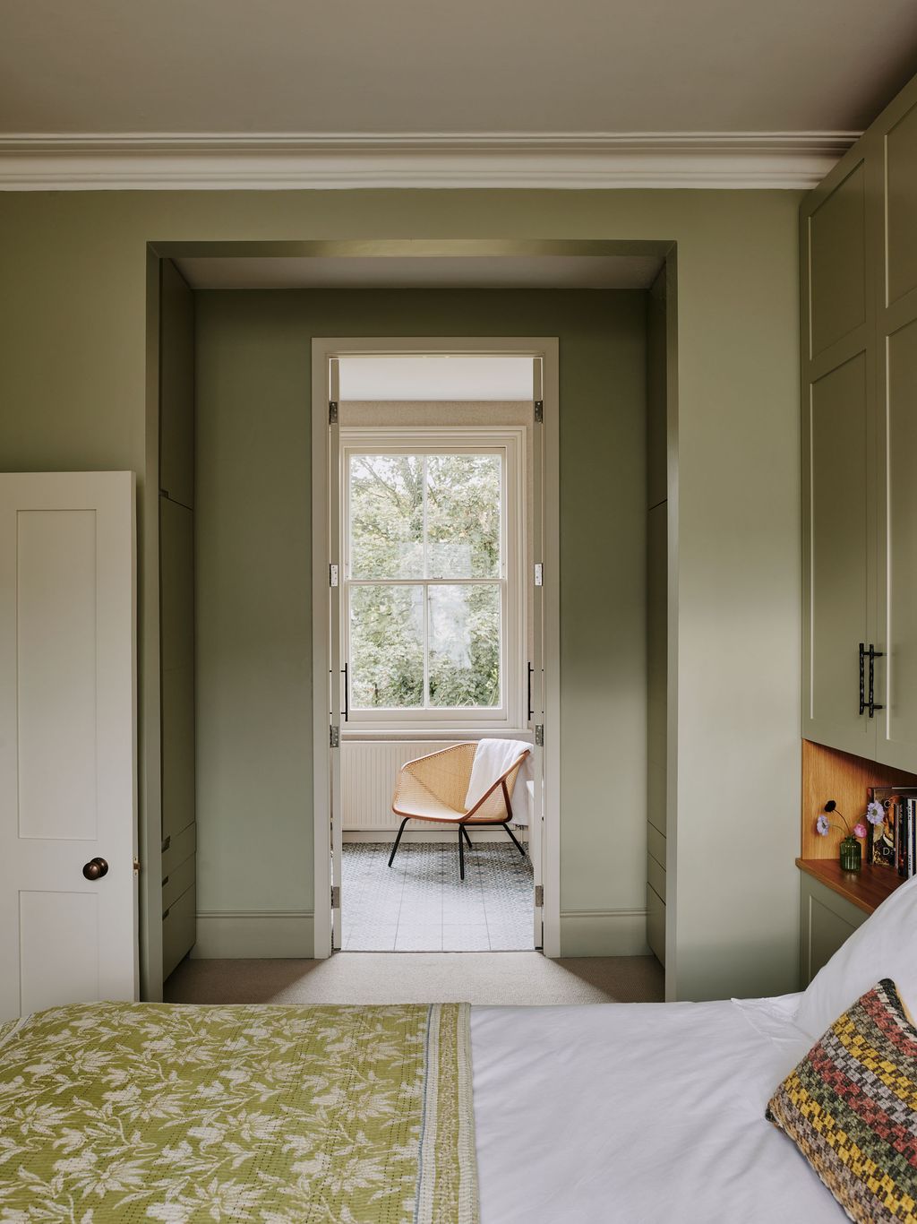 Image may contain Room Bedroom Indoors Furniture Bed Flooring Dorm Room Door and Interior Design