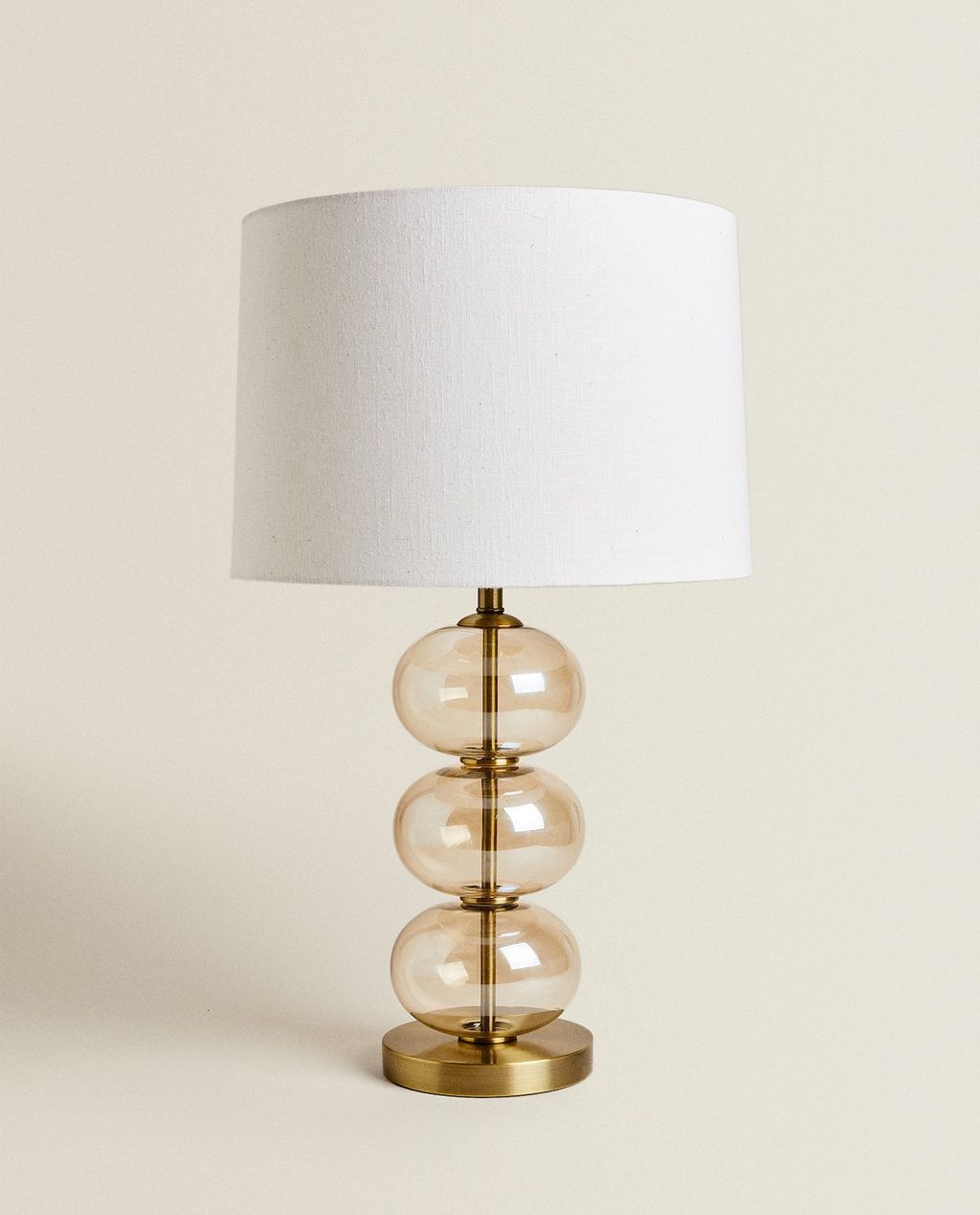 Image may contain Lamp Table Lamp and Lampshade