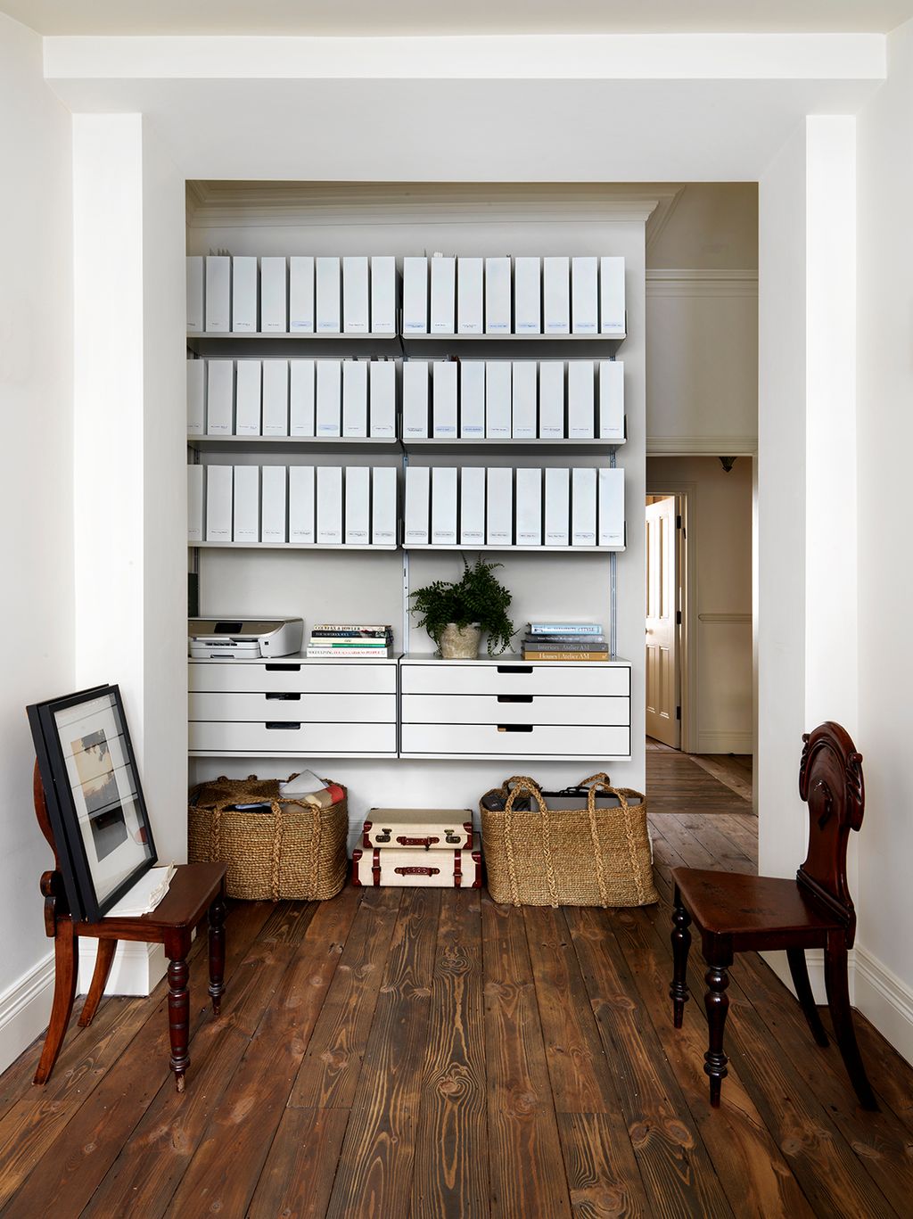 Image may contain Wood Hardwood Flooring Furniture Shelf Floor Bookcase Plywood Chair Interior Design and Indoors