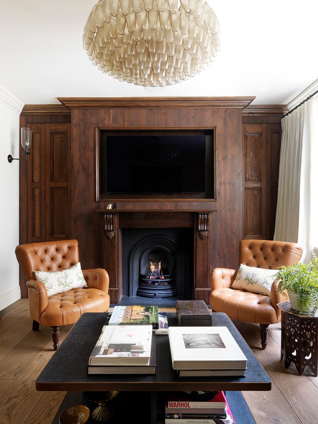 Image may contain Furniture Living Room Room Indoors Table Interior Design Fireplace Hearth Couch and Coffee Table