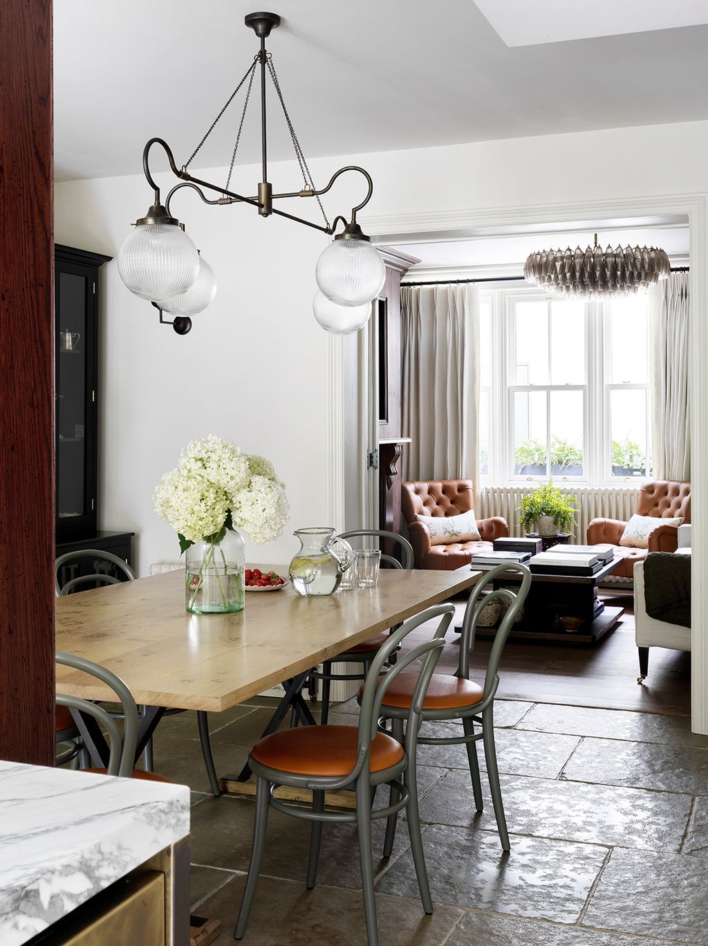 Image may contain Furniture Living Room Room Indoors Wood Chair Table Flooring Hardwood and Interior Design