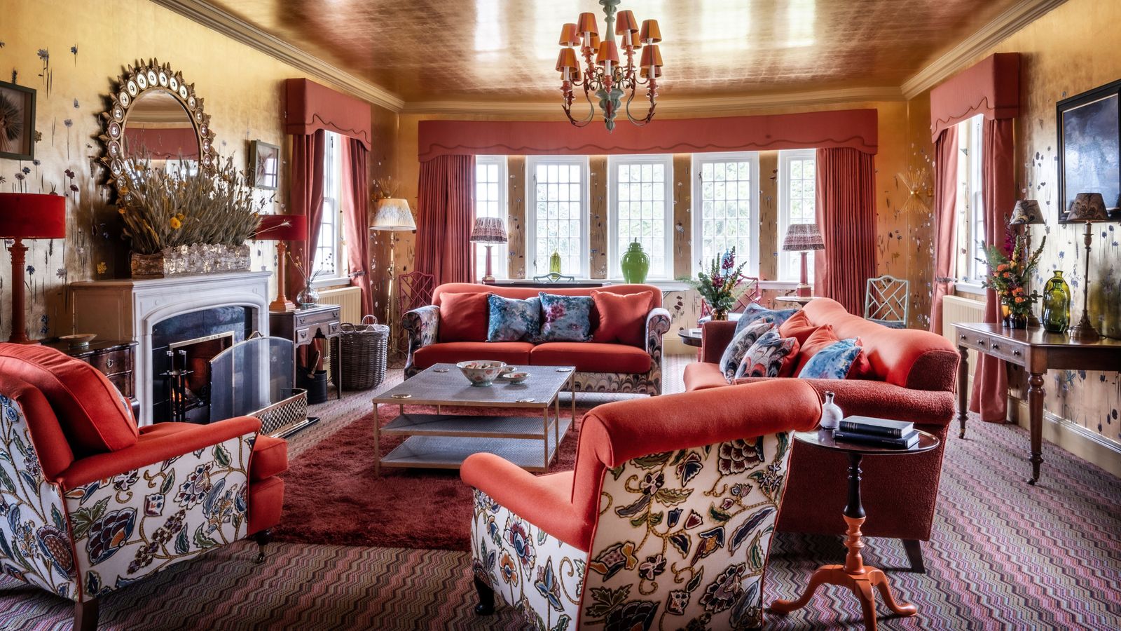 Image may contain: Living Room, Room, Indoors, Furniture, Couch, Interior Design, Lamp, and Wood