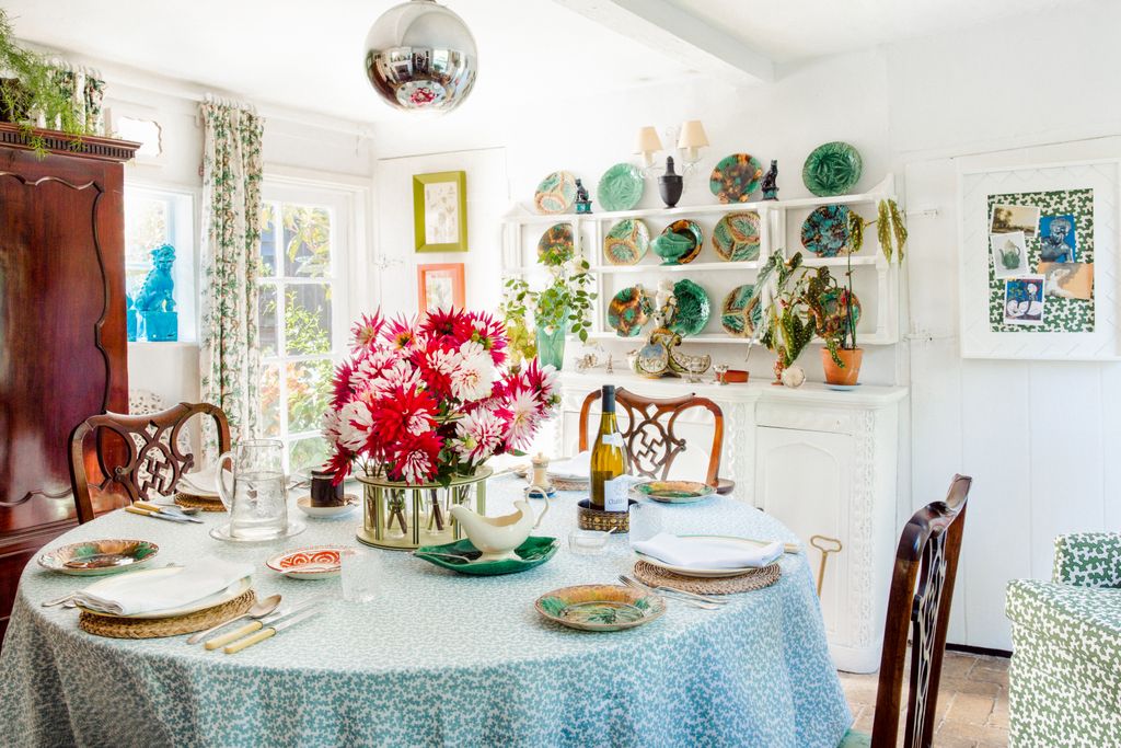 Image may contain Furniture Chair Plant Tablecloth Table Dining Table Room Indoors Flower and Blossom