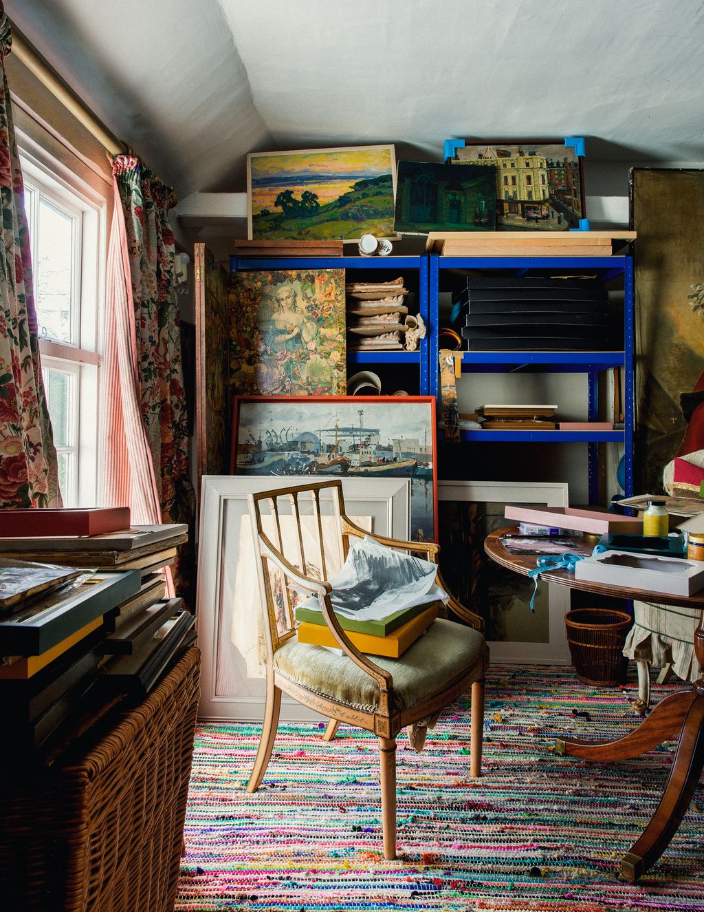 Image may contain Furniture Shelf Bookcase Table Living Room Room Indoors Interior Design Desk Rug and Chair