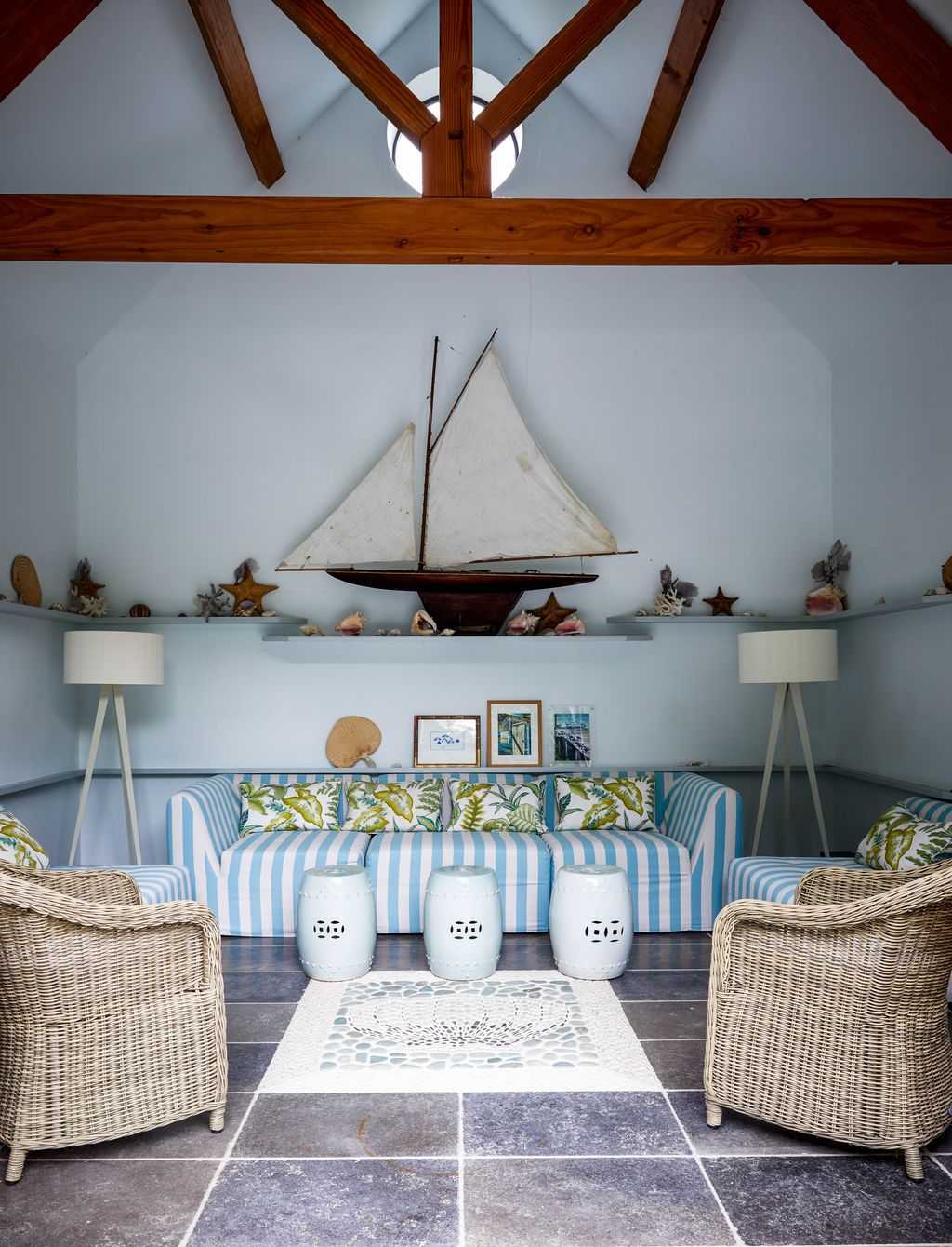 Image may contain Living Room Room Indoors Furniture Interior Design Couch Wood Shelf Hardwood Rug and Table