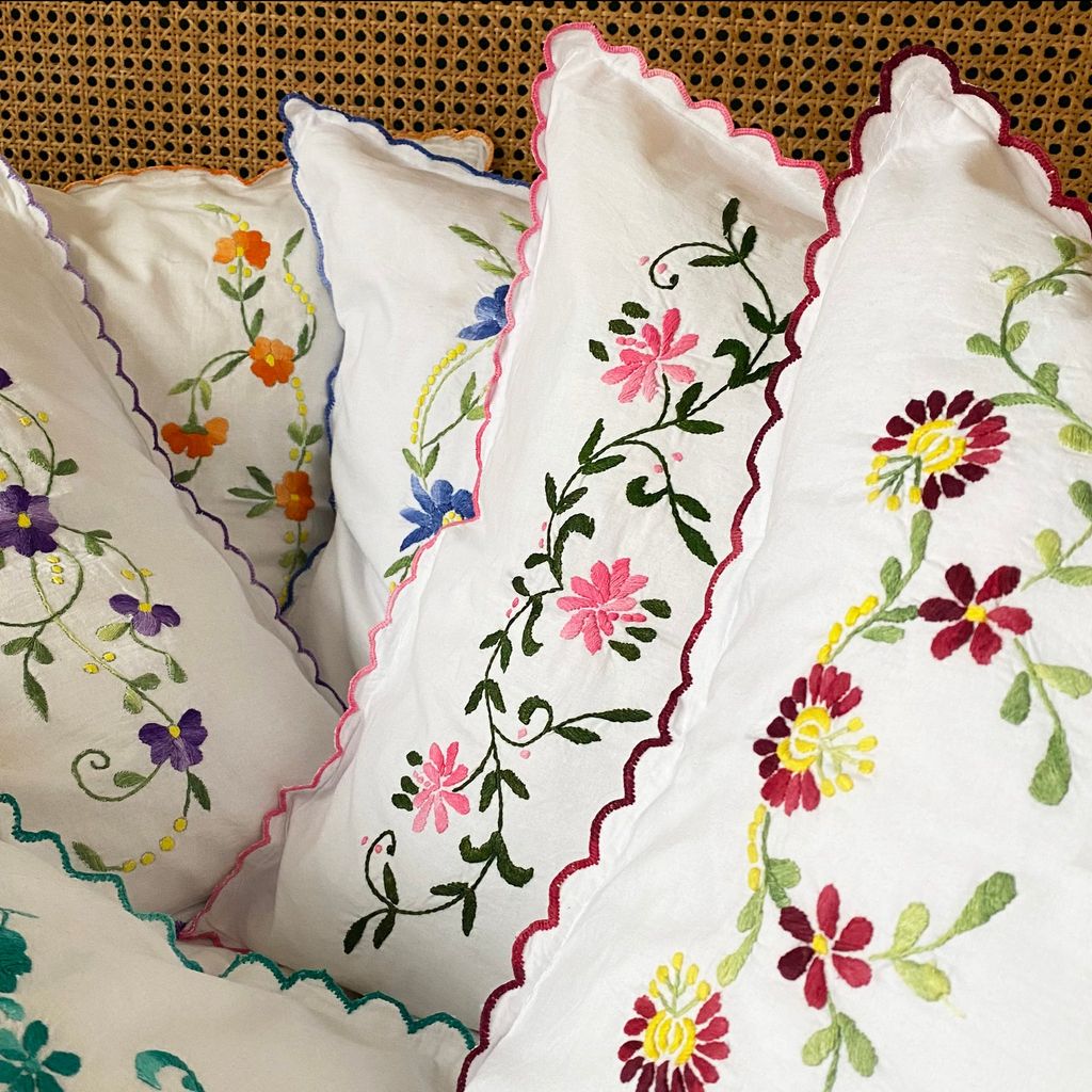 Image may contain Cushion Pillow Pattern Embroidery and Diaper