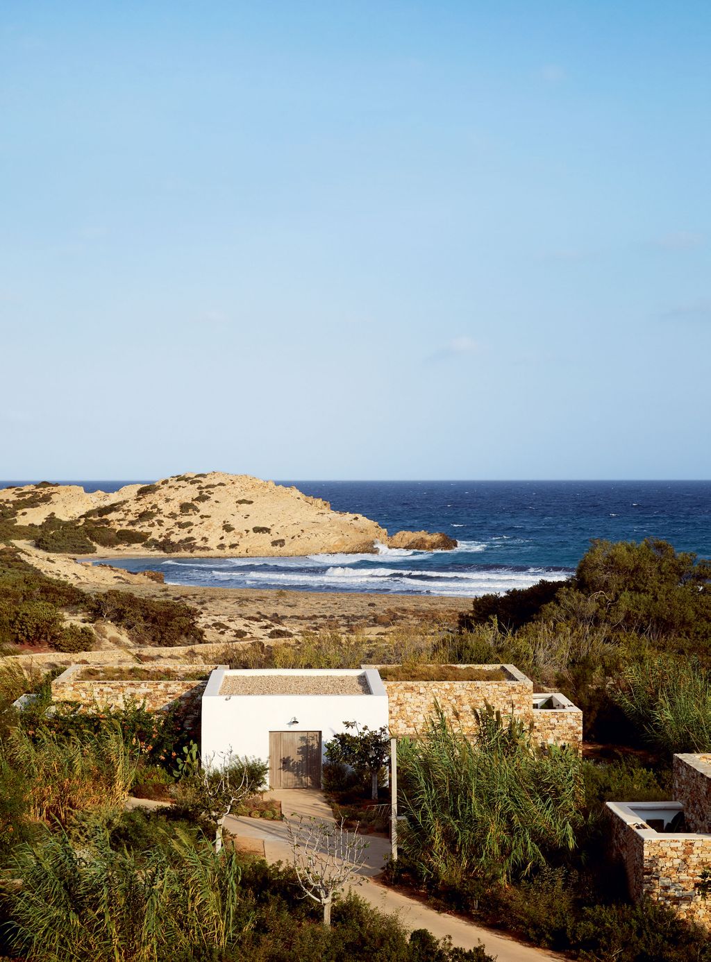 Image may contain Outdoors Nature Land Ocean Water Sea Shoreline Promontory Building Coast Architecture and Tower