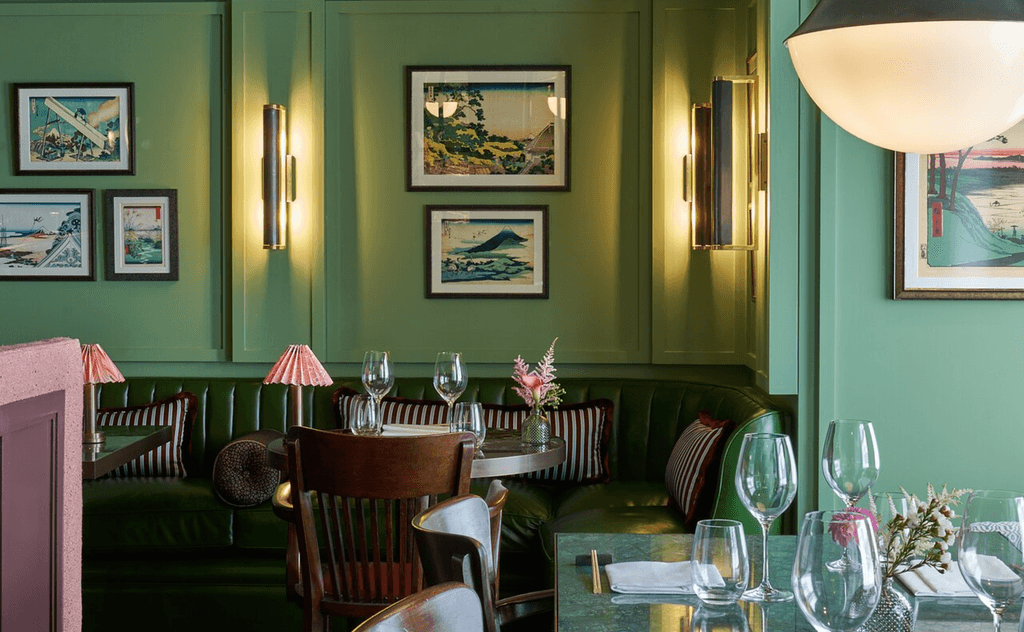 Image may contain Furniture Chair Restaurant Dining Table Table Lamp Table Lamp Cafe Living Room Room and Indoors