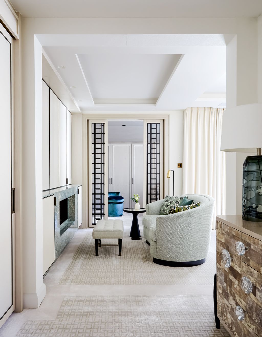 Image may contain Furniture Indoors Living Room Room Interior Design Lobby Fireplace and Table