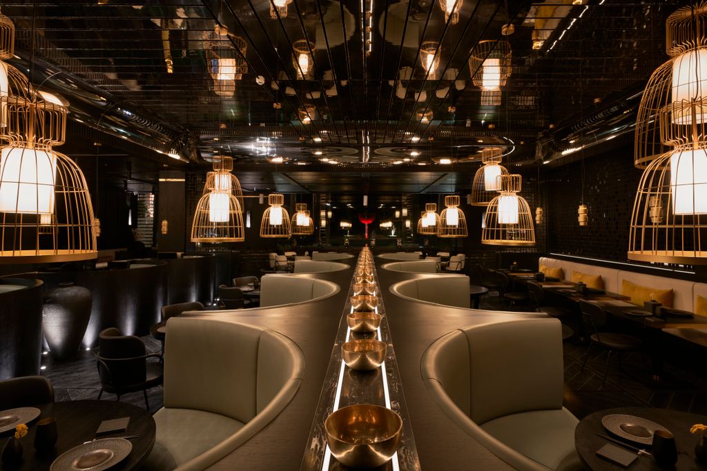 Image may contain Restaurant Furniture Chair Pub Bar Counter and Lighting