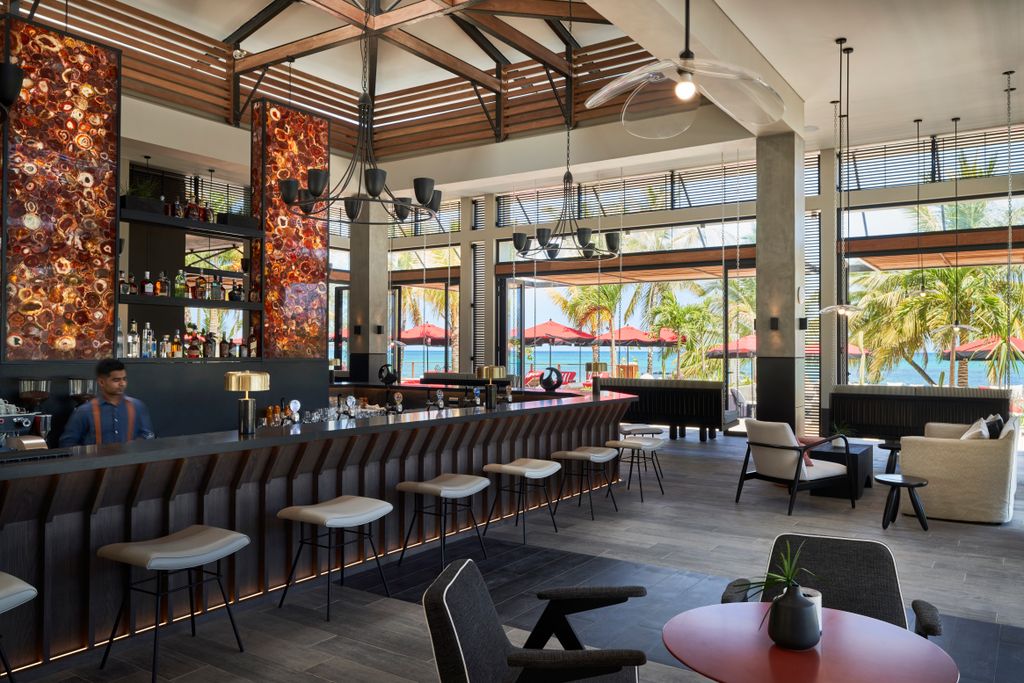 Image may contain Restaurant Human Person Furniture Chair Cafeteria Cafe Pub and Bar Counter