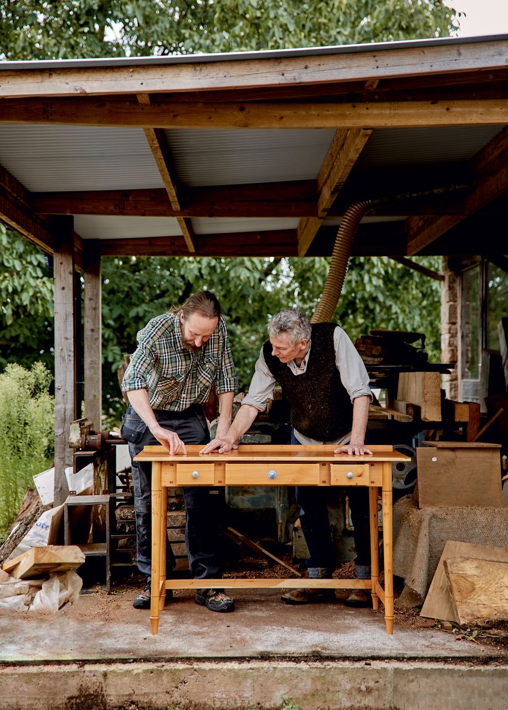 Image may contain Wood Plywood Human Person Porch Lumber and Carpenter