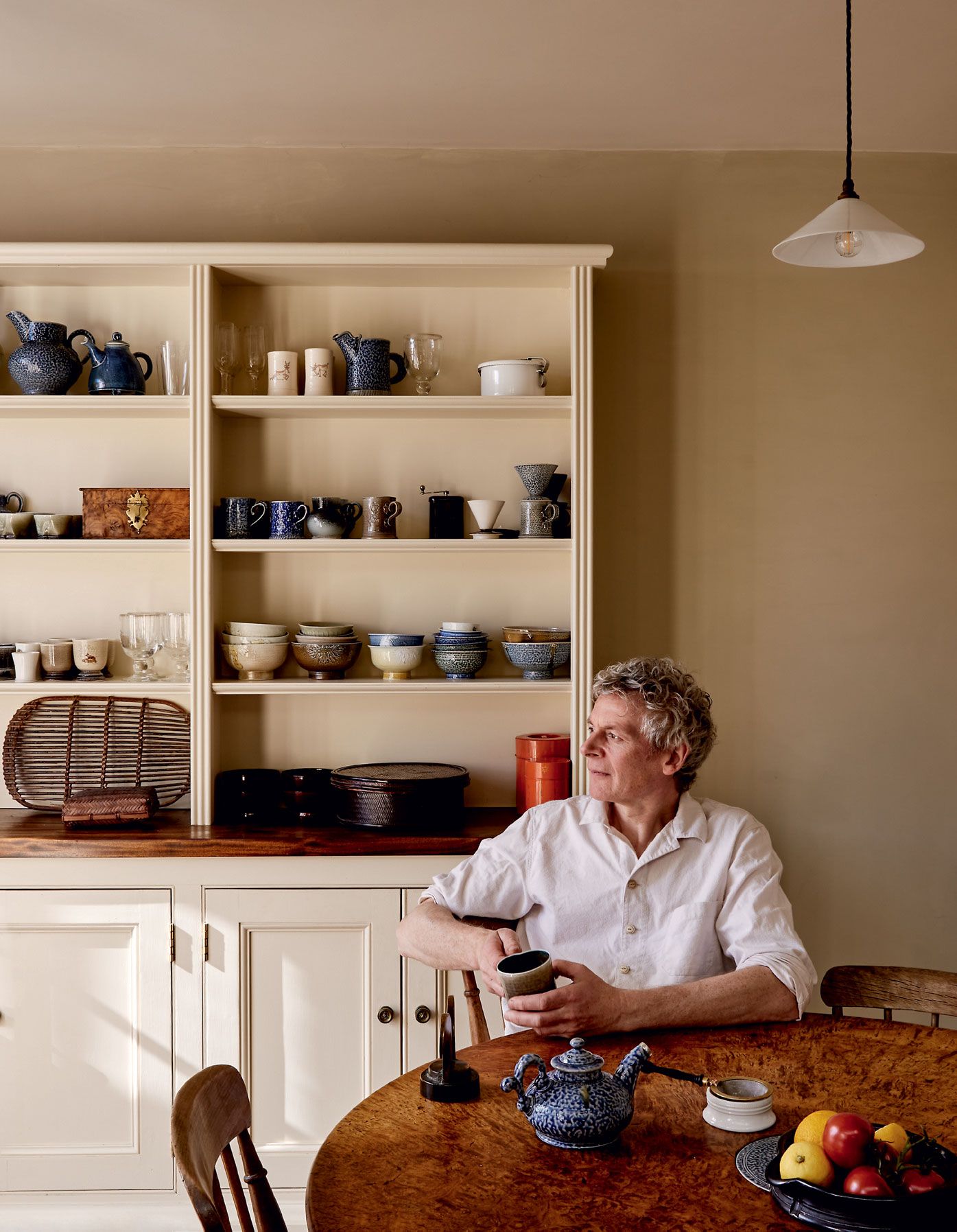 Image may contain Human Person Shelf Furniture and Wood