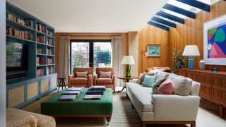 Image may contain Furniture Interior Design Indoors Living Room Room Couch Chair Housing Building Table and Rug