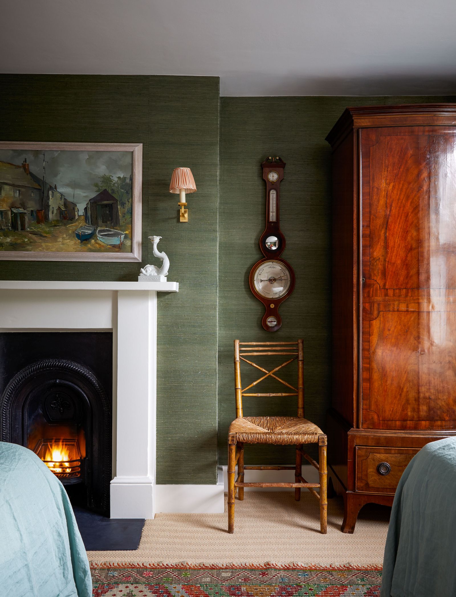 Image may contain Home Decor Furniture Interior Design Indoors Chair Human Person Fireplace Hearth and Linen