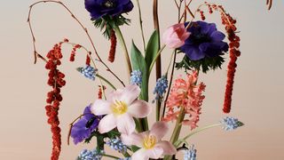 Image may contain Flower Ikebana Ornament Vase Flower Arrangement Plant Art Pottery Jar and Blossom