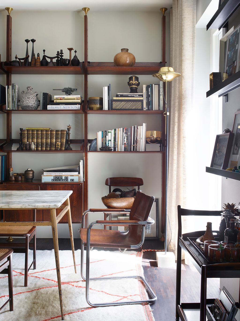 Image may contain Furniture Bookcase Shelf and Table