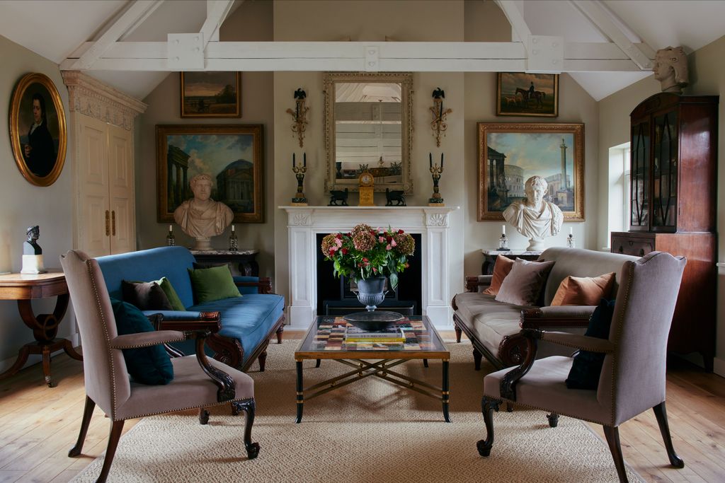 Image may contain Living Room Room Indoors Furniture Augustus Couch Antoninus Pius Human Person Chair and Flooring