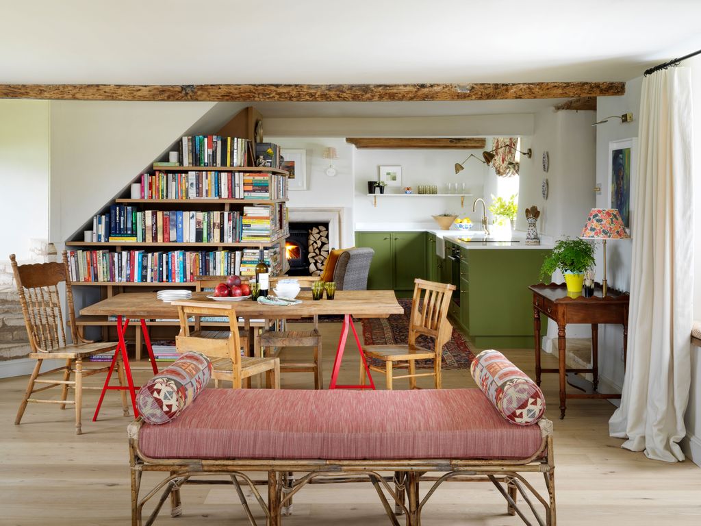 Image may contain Furniture Shelf Chair Bookcase Living Room Room Indoors Interior Design Wood and Flooring