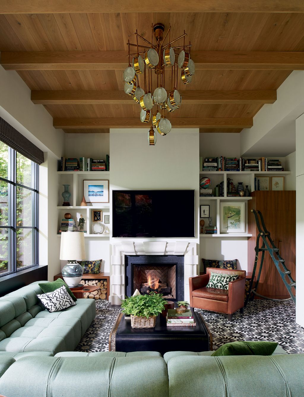 Image may contain Living Room Room Indoors Furniture Interior Design Fireplace Table and Couch