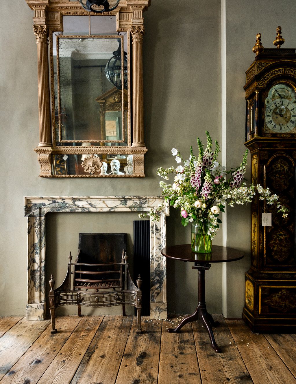 Image may contain Plant Indoors Interior Design Flower Blossom Home Decor Flower Arrangement Fireplace and Furniture